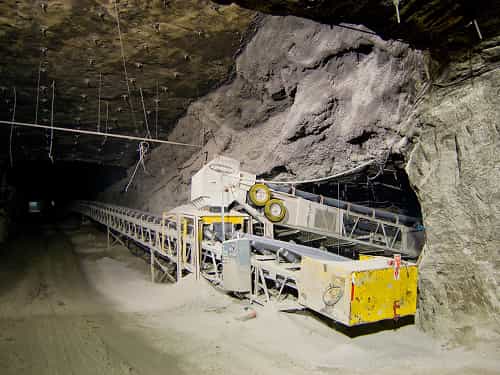 Underground Conveyor in operation at mineral mine tunnel entrance in Missouri